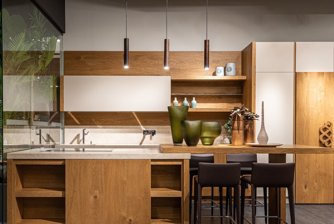 about-04 Explore this elegant modern kitchen featuring wooden cabinets and minimalist decor.
